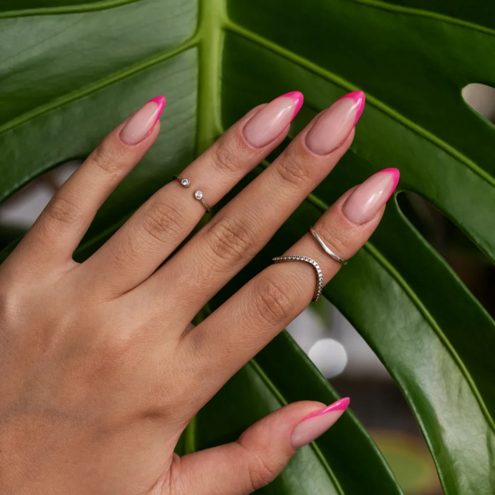 woman-showing-her-nail-art-fingernails-against-monster-leaf (1)